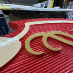 Sandblasted Dimensional Sign with Raised Copy and Elements